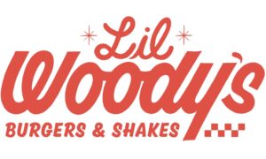 "Lil Woody's" in red cursive, and "Burgers & Shakes" in non-cursive red capital letters. Asterix next ton "Lil"