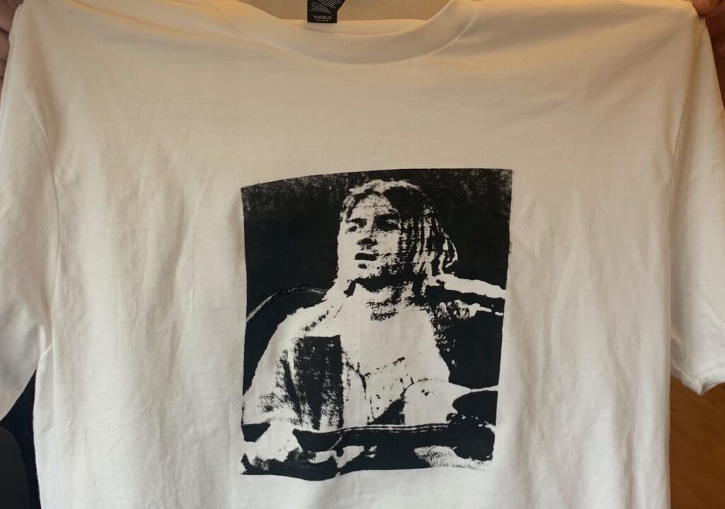 Screen print of a photo of Kurt Cobain on a white t-shirt