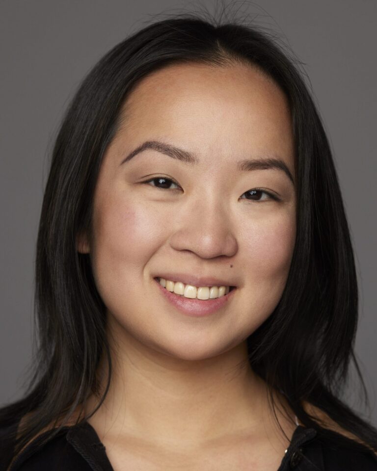 Headshot of Pearl Mei Lam, an Asian American woman in her 20s, with shoulder-lenght hair, smiling at the camera.